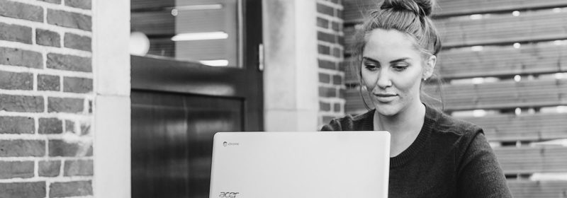Woman looking at laptop